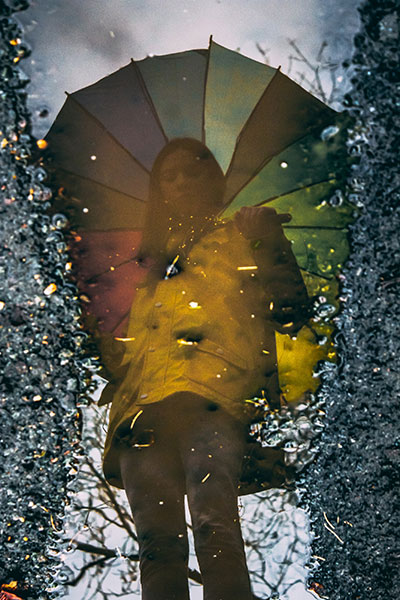Autumn photo ideas for Instagram - reflection with in a puddle with an umbrella